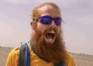 a bearded runner yelling